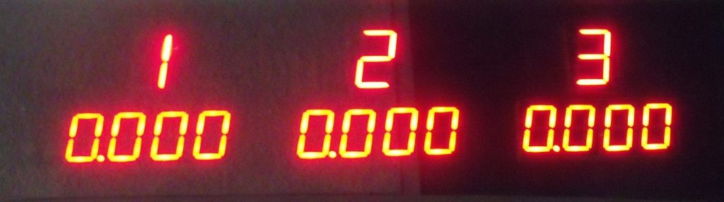 A lit Derby Magic finish-line timer display showing the lane order